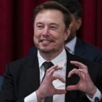 Elon Musk makes a heart with his hands during a Senate bipartisan Artiﬁcial Intelligence (Al) Insight Forum on Capitol Hill in Washington, DC, US