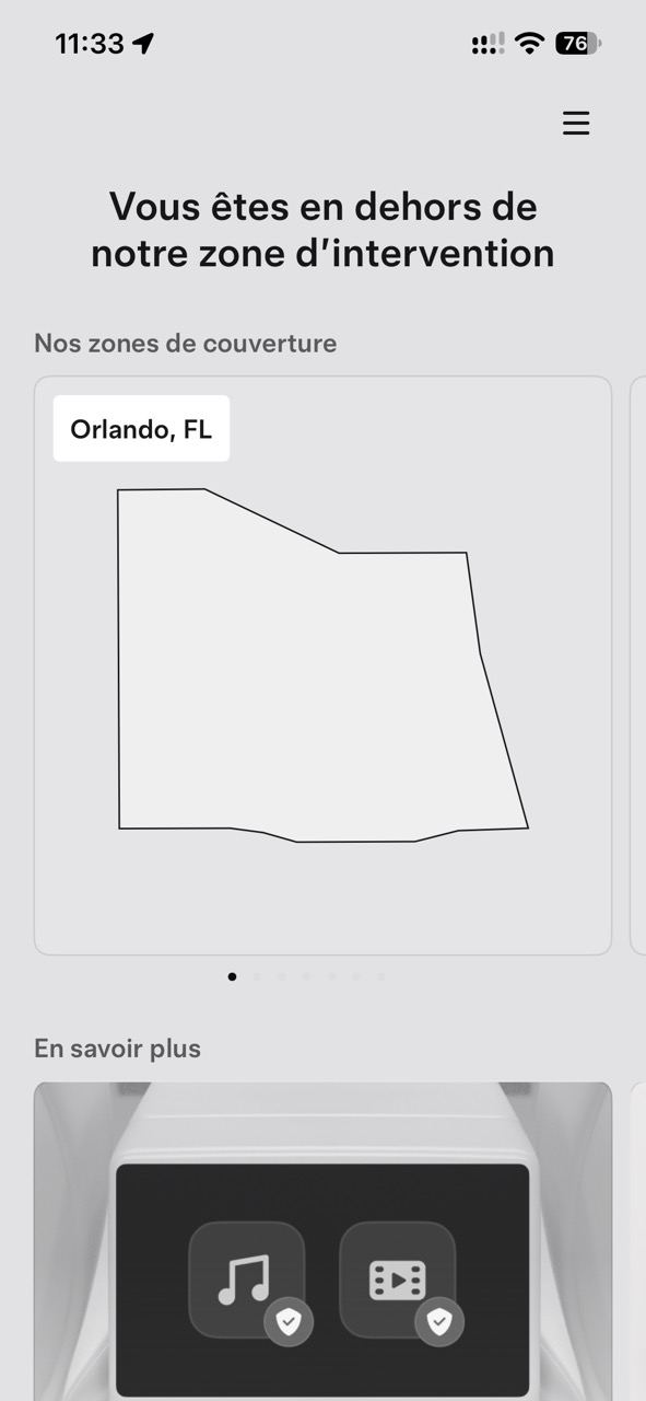 Écran de l’application Tesla Robotaxi en français : « Vous êtes en dehors de notre zone d’intervention », avec la carte de la zone de couverture d’Orlando, en Floride