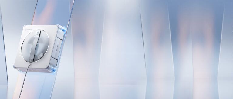 Le robot lave-vitres Ecovacs WINBOT W2S PRO fixé sur une baie vitrée