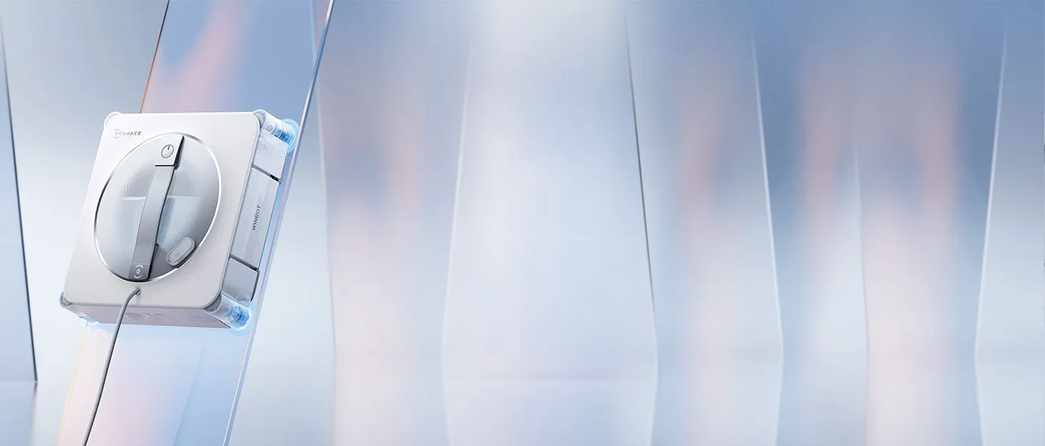 Le robot lave-vitres Ecovacs WINBOT W2S PRO fixé sur une baie vitrée