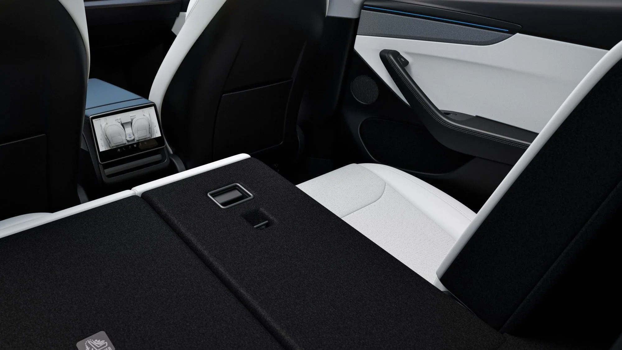 Coffre de la nouvelle Tesla Model Y avec la banquette arrière rabattue