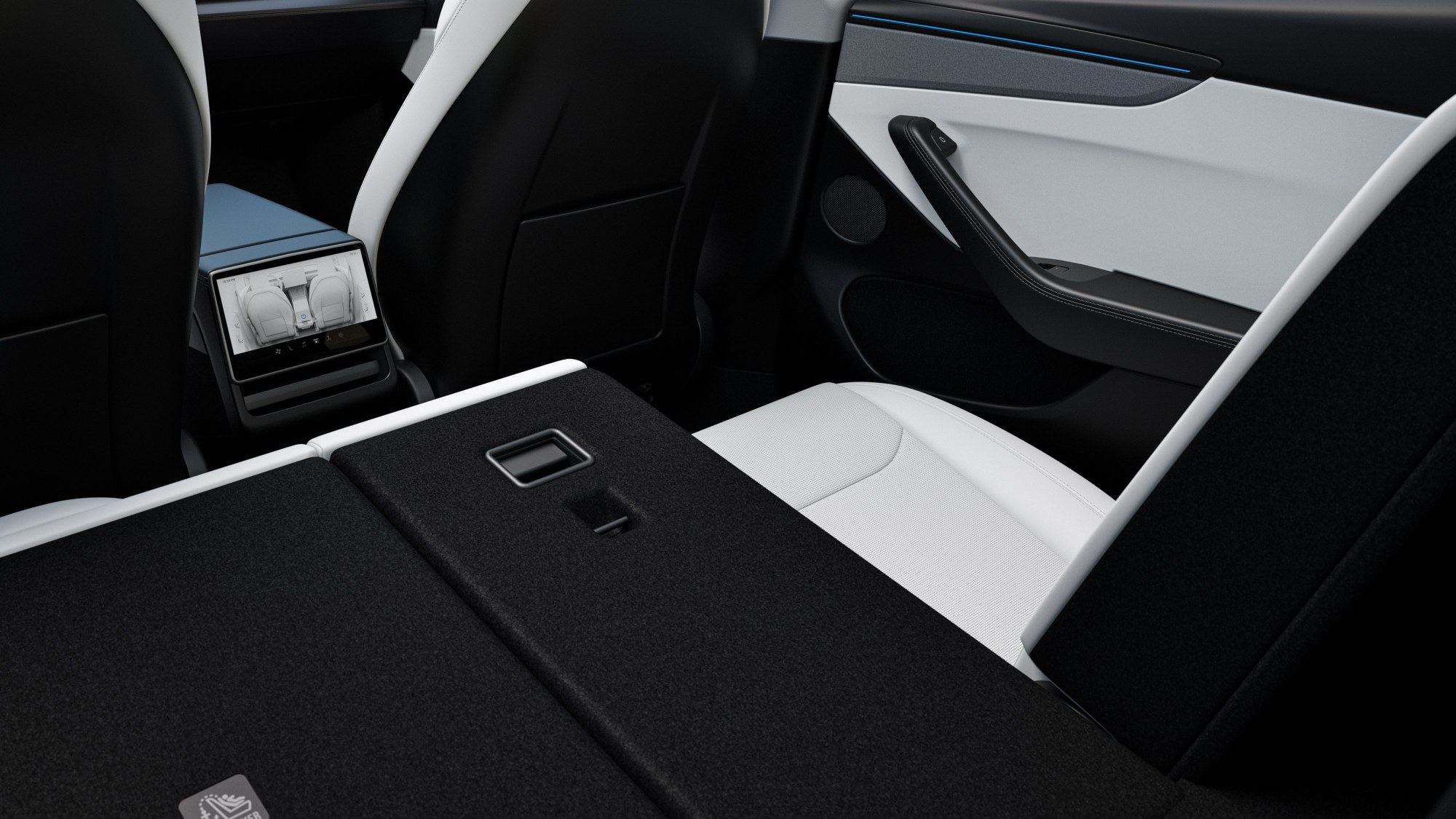 Coffre de la nouvelle Tesla Model Y avec la banquette arrière rabattue