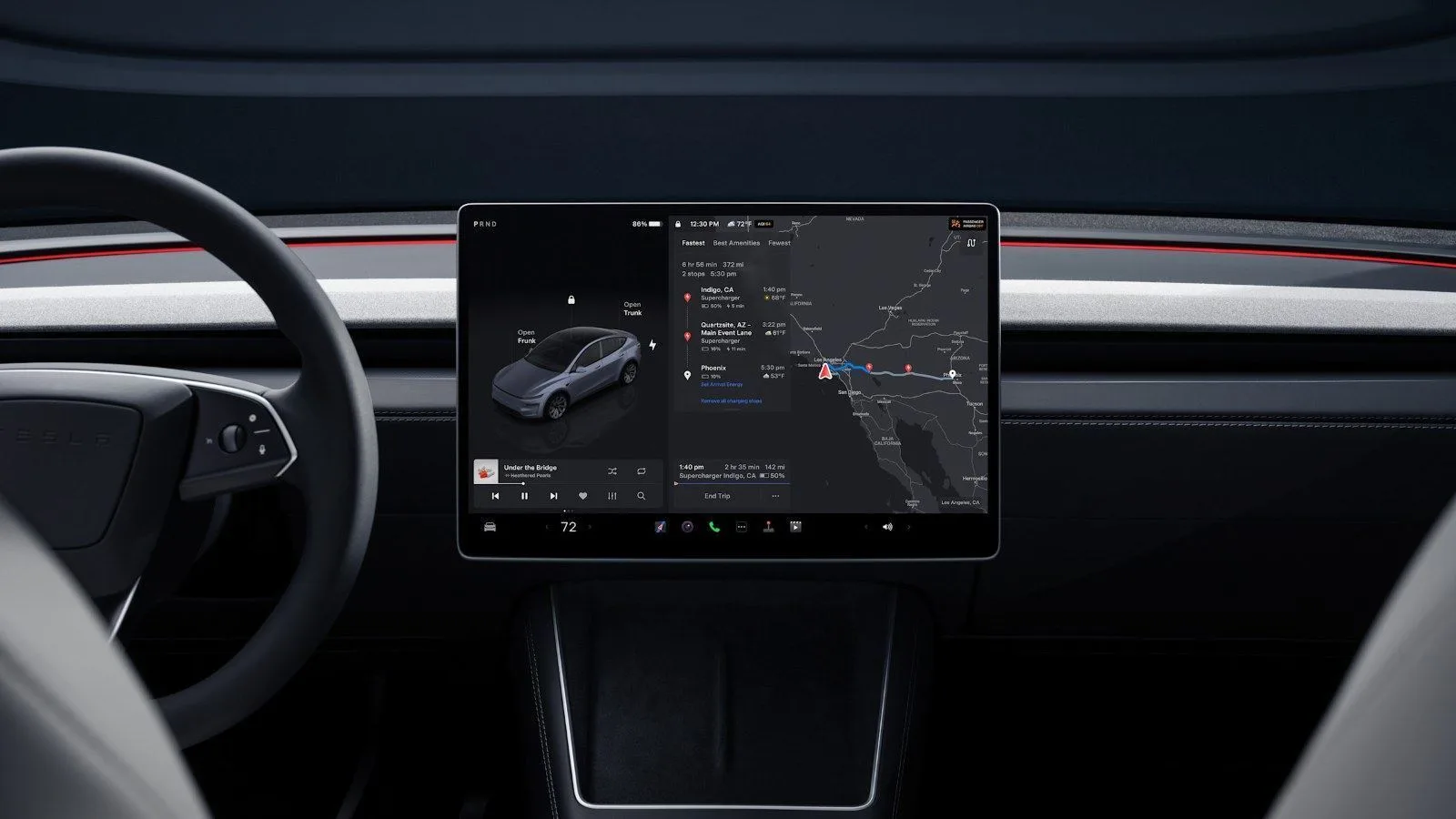Close-up of the central touchscreen of a Tesla Model Y showing the car, music and map